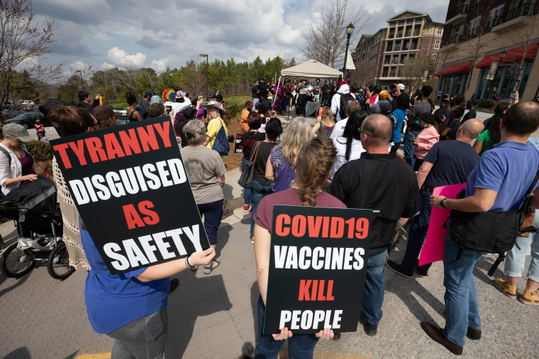 Image: Demonstrators protest outside the Centers for Disease Control and Prevention (CDC) headquarters in Atlanta on March 13, 2021.
