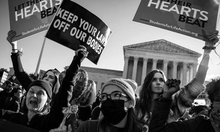 Protestors gather outside the Supreme Court as arguments begin about the Texas abortion law by the court on Capitol Hill on Nov. 01, 2021 in Washington.