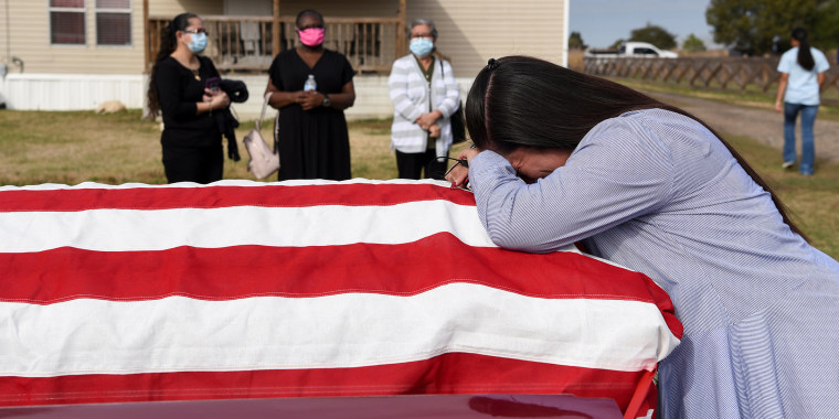 Image: The Wider Image: 'I just ask God to help me': Texas funeral home crushed by death as U.S. COVID toll nears 500,000