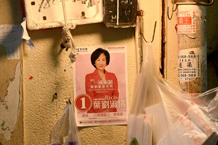 Image: A campaign poster at a market in Hong Kong before the city's legislative elections