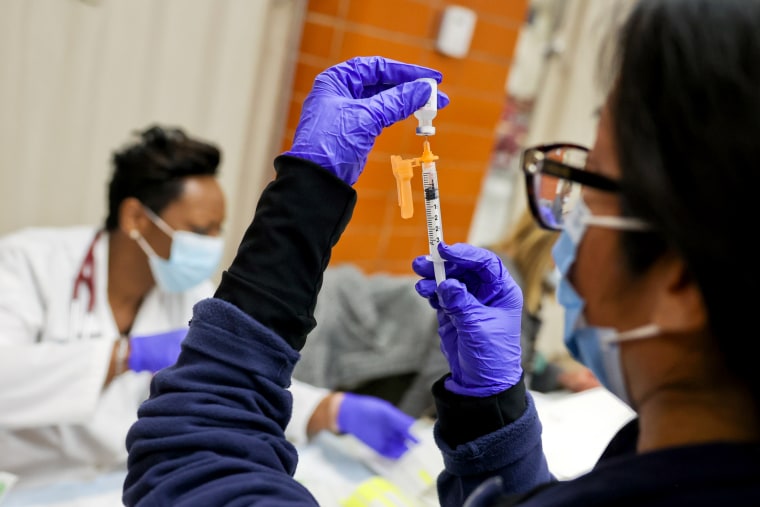Doctor prepars pediatric doses of Covid-19 vaccine on Long Island