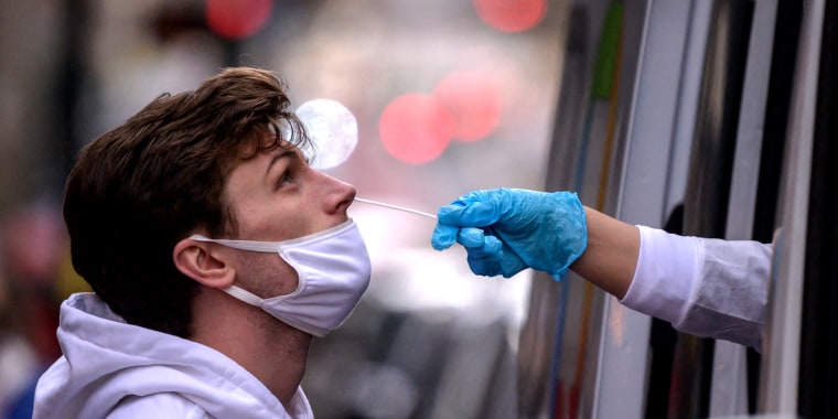 Image: A person receives a nasal swab during a test for Covid-19.