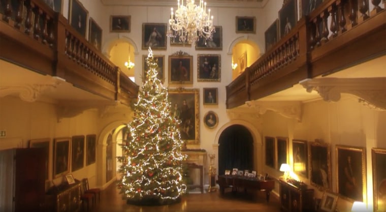 Dozens of family portraits, including one of Princess Diana, hang over the staircase. 