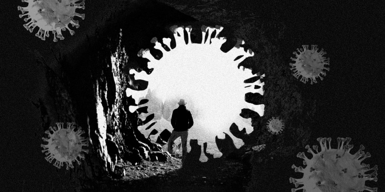 Photo illustration: A person standing at a Covid particle shaped opening of a dark cave.