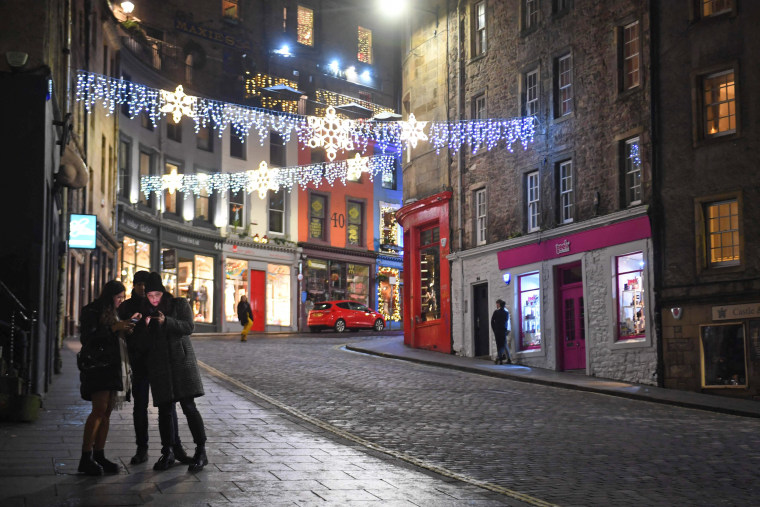 A near-deserted Victoria Street in the center of Edinburgh, Scotland, on New Year's Eve.