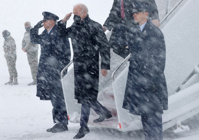 Image: President Joe Biden arrives at Andrews Air Force Base, Md., in during a snow storm on Jan. 3, 2022.