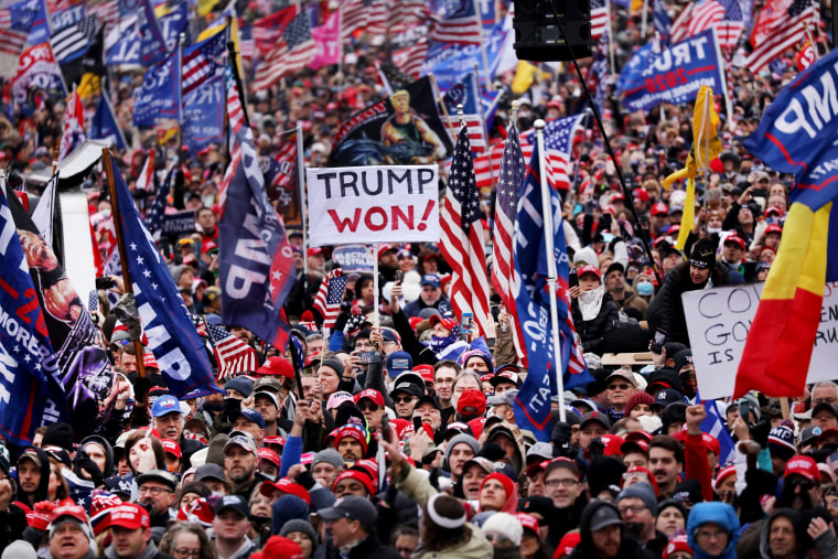 Image: Crowds gather to protest the ratification of Joe Biden's electoral college win over then-President Donald Trump on Jan. 6, 2021.
