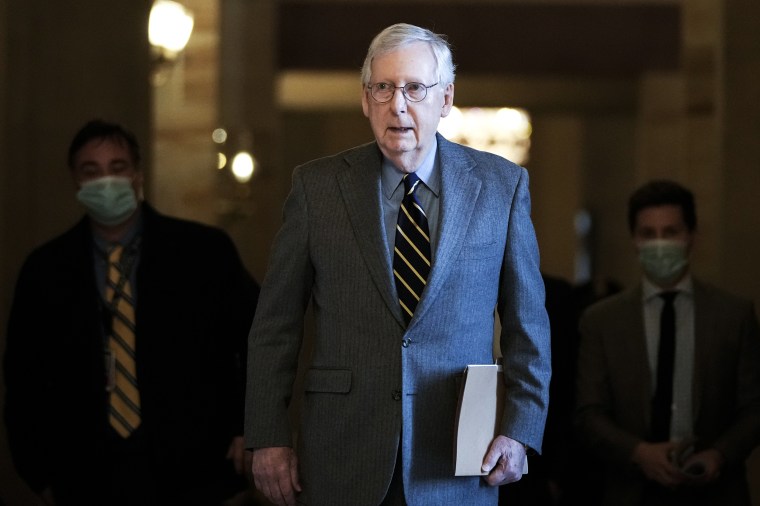 Image: Senate Minority Leader Mitch McConnell walks to the Senate floor at the Capitol on Jan. 5, 2022.