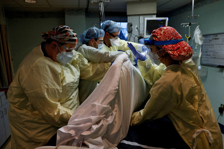 Medical staff treat a coronavirus patient at Western Reserve Hospital in Cuyahoga Falls, Ohio, on Jan. 4, 2022.