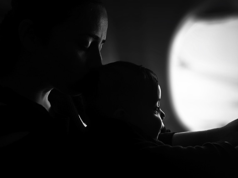 Close-Up Of Mother With Son In Darkroom
