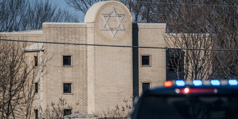 A law enforcement vehicle sits in front of the Congregation Beth Israel synagogue on Jan. 16 in Colleyville, Texas.