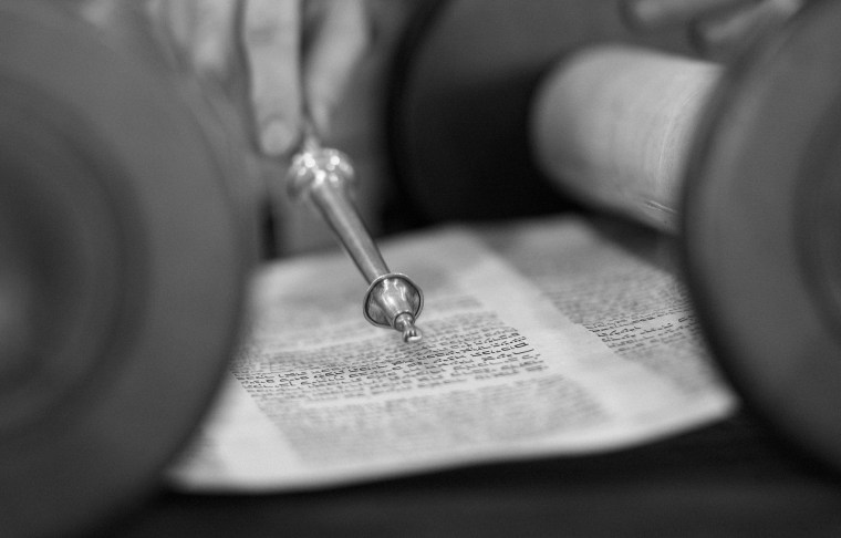 A man reads from the Torah during Shaharit service at Temple Beth Shalom in Long Beach, Calif., on May 1, 2014.