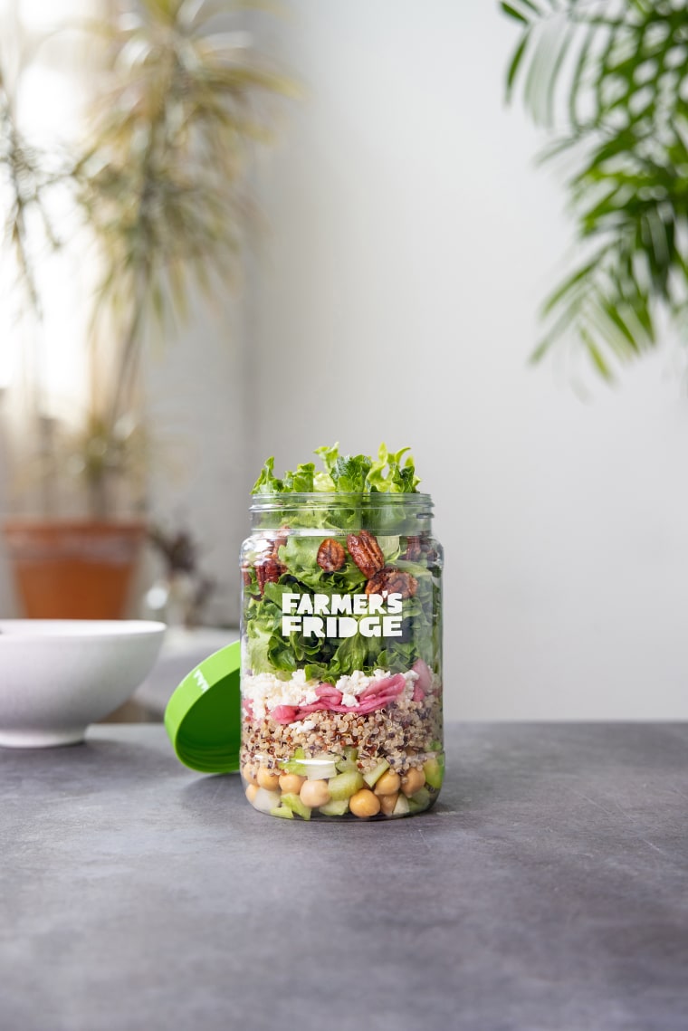 Farmer's Fridge Green Goddess Salad has 560 calories with dressing, 16 grams of plant protein, and plenty of texture from candied pecans and pickled onions.