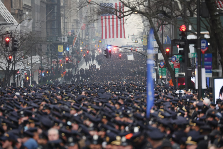 Thousands of police officers from around the country gather at St. Patrick's Cathedral to attend the funeral for fallen NYPD Officer Jason Rivera on January 28, 2022 in New York City. The 22-year-old NYPD officer was shot and killed on January 21 in Harle