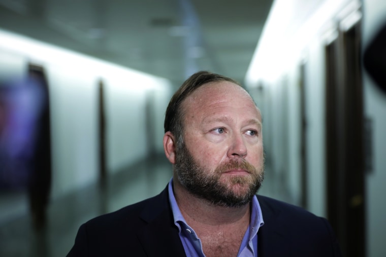 Image: Alex Jones speaks to reporters outside of a Senate Intelligence Committee hearing on Sept. 5, 2018.