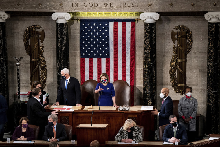 Image: House Speaker Nancy Pelosi and Vice President Mike Pence officiate as a joint session of the House and Senate convenes to confirm the Electoral College votes cast in November's election, at the Capitol on Jan. 6, 2021.