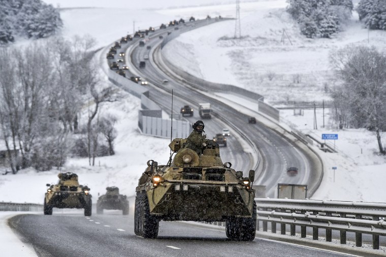 Image: A convoy of Russian armored vehicles moves along a highway in Crimea on Jan. 18, 2022.