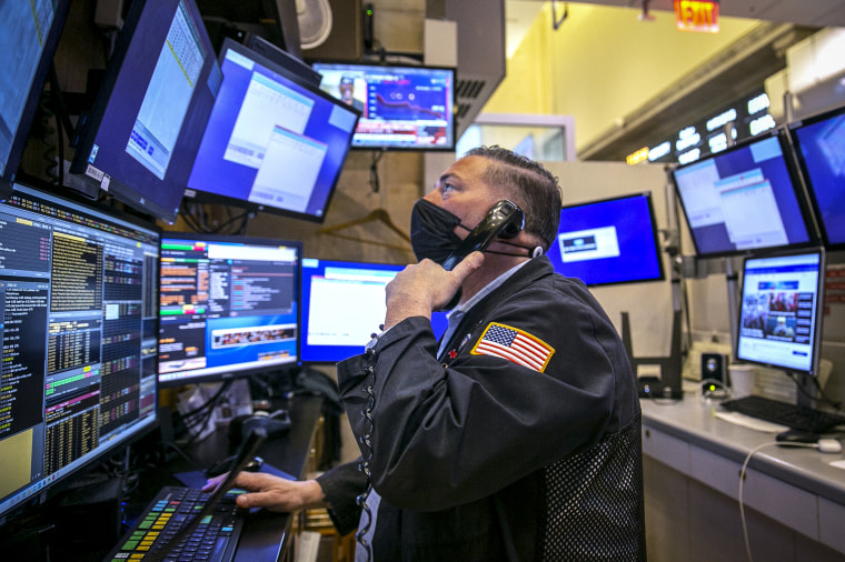 Image: Trader Jonathan Mueller works on the New York Stock Exchange floor in New York City on Jan. 25, 2022.