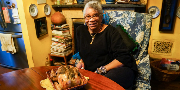 Jessica B. Harris at home with her roast chicken (poulet roti).
