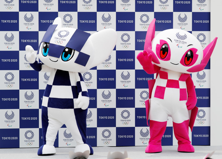 Tokyo 2020 Olympic Games mascot Miraitowa and Paralympic mascot Someity wave on stage during the mascots' debut in Tokyo, Japan, July 22, 2018.