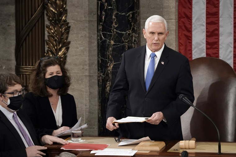 Image: Vice President Mike Pence officiates as a joint session of the House and Senate convenes to confirm the Electoral College votes cast in November's election, at the Capitol ion Jan. 6, 2021.