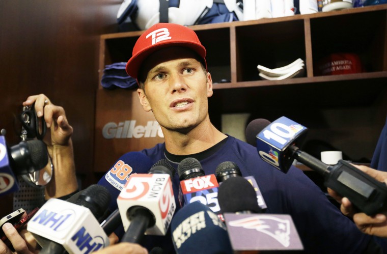 New England Patriots quarterback Tom Brady speaks with reporters in the locker room at Gillette Stadium