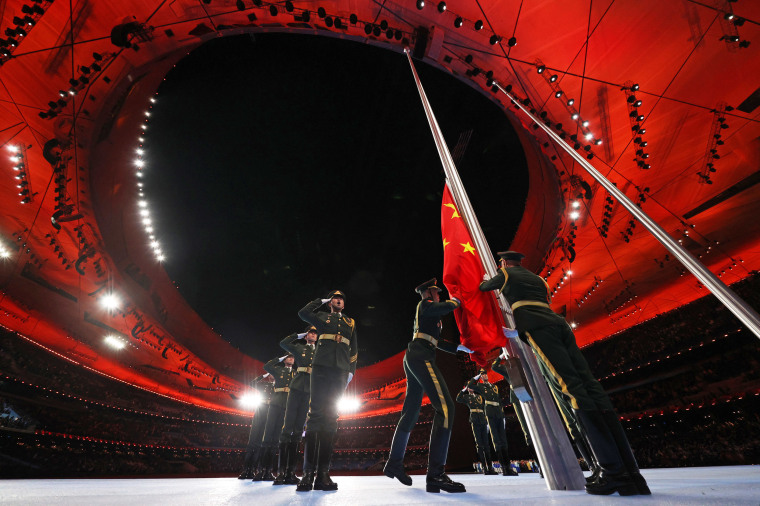 The Chinese flag is raised inside the stadium.