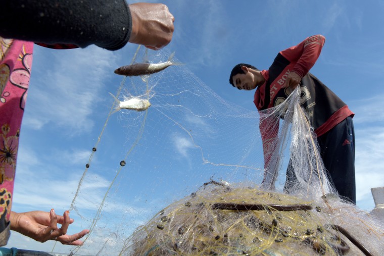 Image: Cambodian fisherman Sles Hiet lives at the mercy of the Mekong