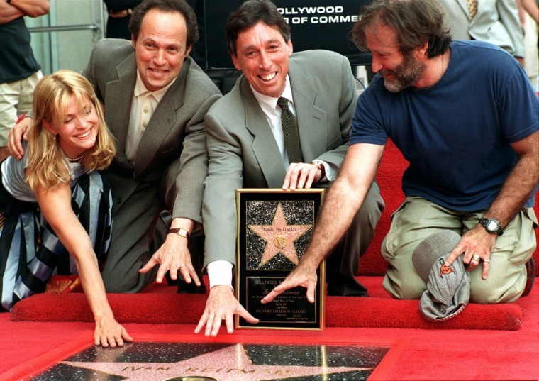 Ivan Reitman, center, is honored with a star on the the Hollywood Walk of Fame, on the Hollywood Boulevard, on May 5, 1997, in the Hollywood section of Los Angeles Actors Natasha Kinski, Billy Crystal, and Robin Williams were also present at the event.