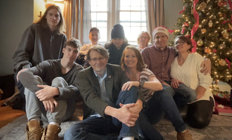 Jennifer Folsom with her husband, three teenage sons, mom, dad, brother and his partner on Christmas Eve of 2021.
