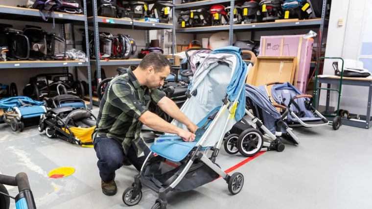 CR test engineer Adam Nappi measures how far a stroller seat reclines to determine whether it's suitable for an infant.