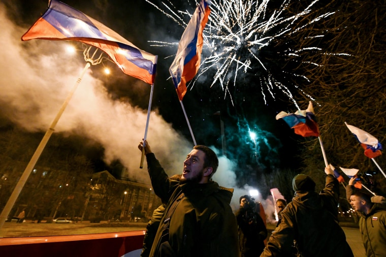 People of self-proclaimed Donetsk People's Republic celebrate Monday after being recognized by Russia