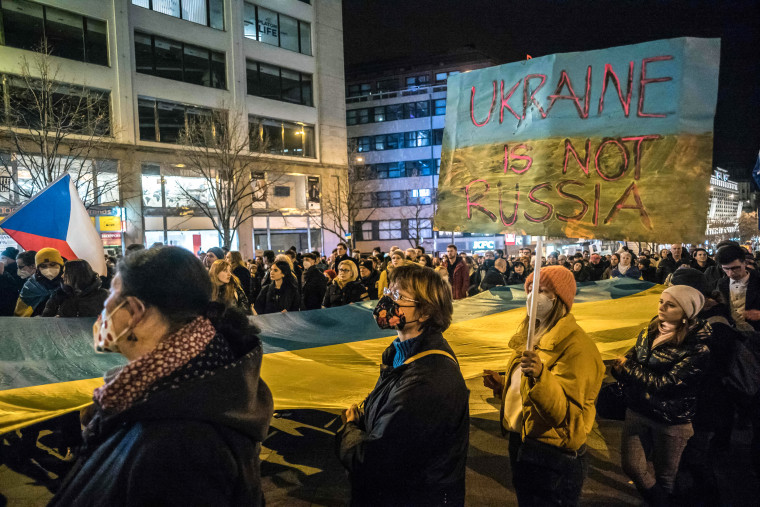Image: Pro-Ukraine demonstrators display placards and Ukrainian flags during a demonstration in support to Ukraine at the Wenceslas square in Prague, Czech Republic on Feb. 22, 2022 following Russia's recognition of eastern Ukrainian separatists.