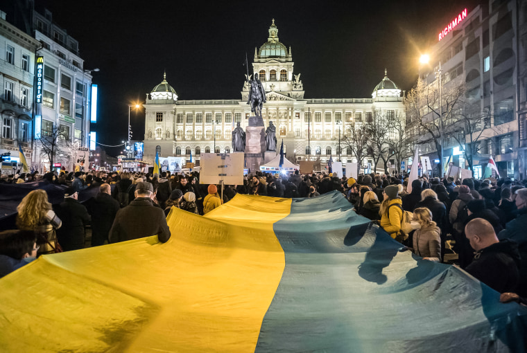 Image: Pro-Ukraine demonstrators display a Ukrainian flag during a demonstration in support to Ukraine at the Venceslas square in Prague, Czech Republic on Feb. 22, 2022 following Russia's recognition of eastern Ukrainian separatists.