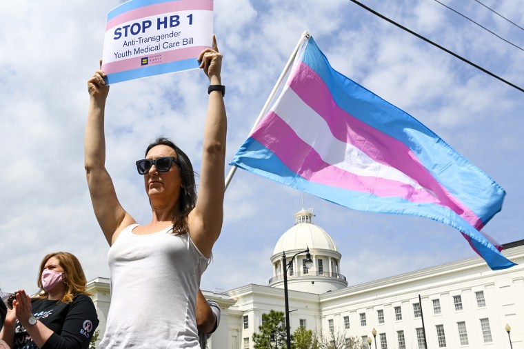 People rally against anti-transgender legislation outside the Alabama State House on March 30, 2021, in Montgomery.