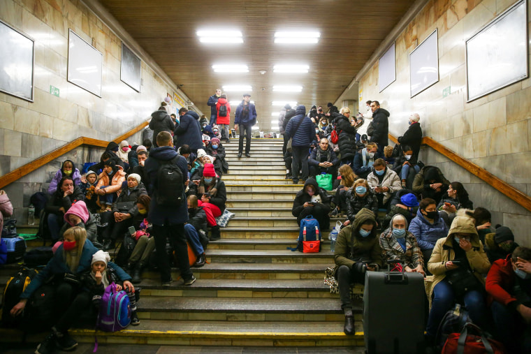 People take shelter in a Kyiv subway station after Russian forces invaded Ukraine on Feb. 24, 2022.