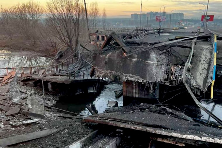 Ukrainian armed forces blow up a bridge near the town of Irpin so as not to let the Russian army come closer to Kyiv on Feb. 25, 2022.