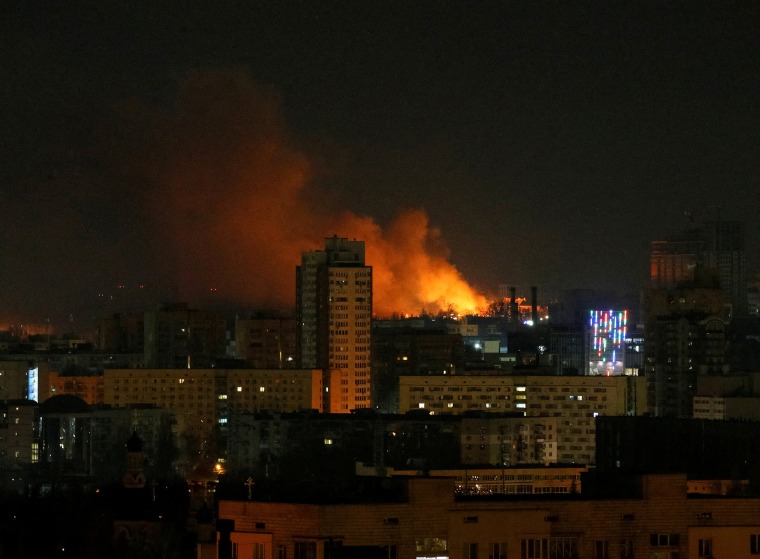 Image: Smoke and flames rise over during the shelling in Kyiv