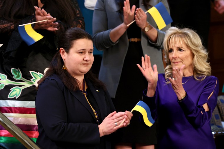 IMage: First lady Dr. Jill Biden applauds the Ukrainian Ambassador to the United States Oksana Markarova.