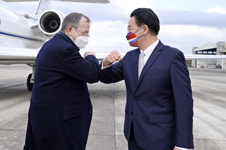 Mike Mullen, left, former chairman of the U.S. Joint Chiefs of Staff, greets Taiwan Foreign Minister Joseph Wu at Taipei Songshan Airport in Taiwan on Tuesday.