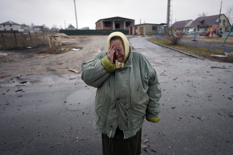 Image: A woman cries outside houses damaged by a Russian airstrike outside the capital Kyiv, Ukraine, on March 2, 2022.
