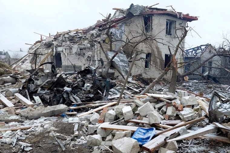 A destroyed building can be seen in a residential area in Zhytomyr