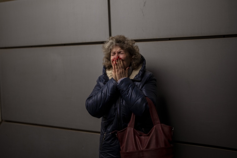 Image: Natalia, 57, cries as she says goodbye to her daughter and grandson on a train to Lviv at the Kyiv station, Ukraine on  March 3. 2022.