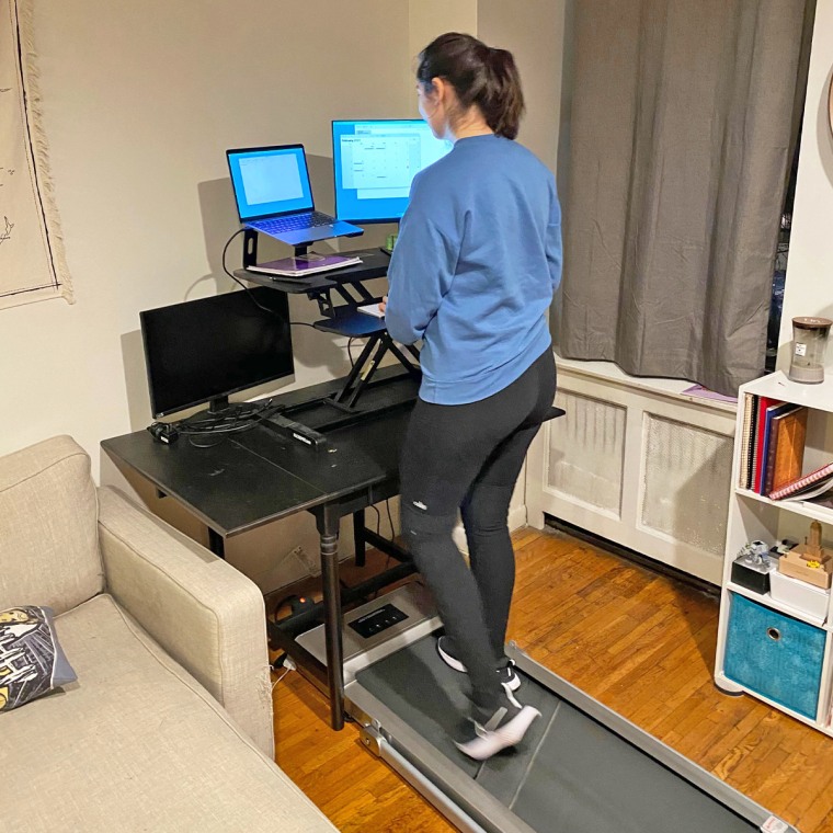 Senior commerce editor Alexandra Deabler using the Doufit electric foldable treadmill