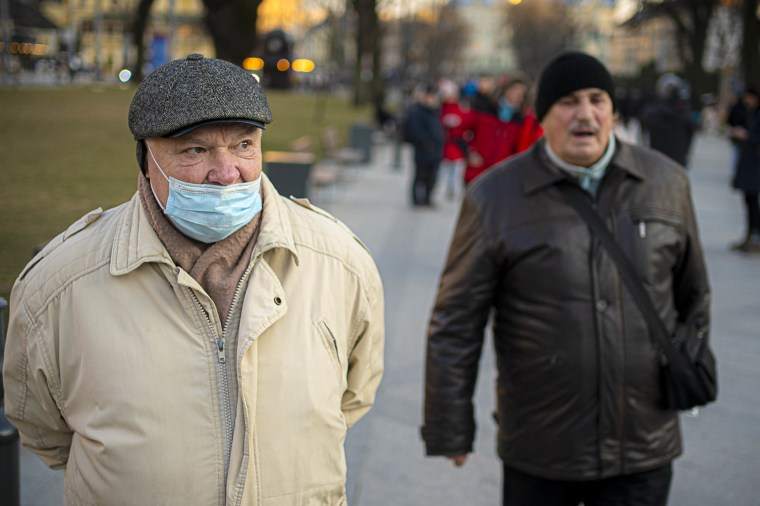 Ukrainian residents Myroslav Pavlyshyn 63, left, and Myron Beheza 72, in Lviv, on Sunday.