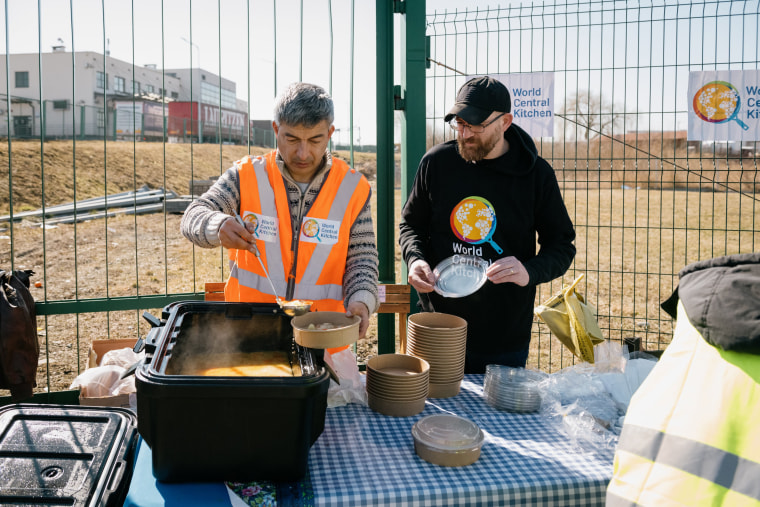 Image: Fara Shojaian, left, serves soup to Ukrainians crossing the border. 