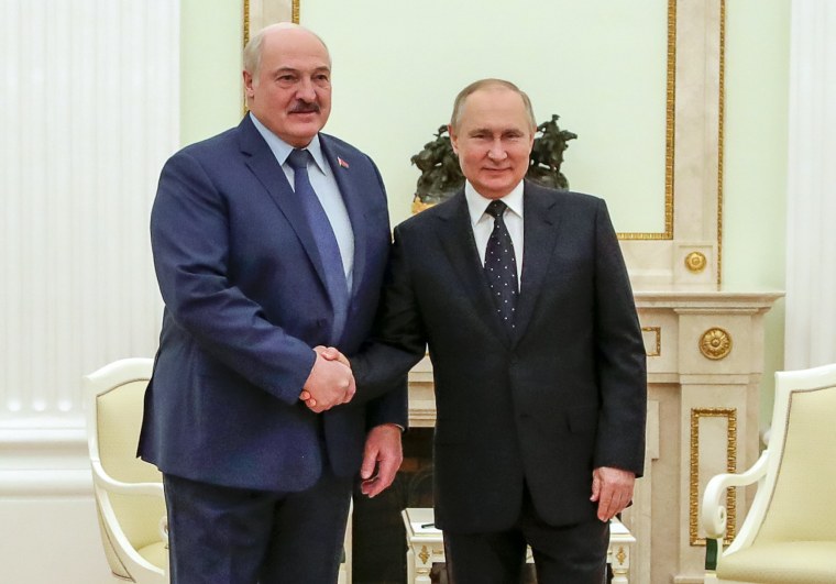 Image: Russian President Vladimir Putin, right, and Belarusian President Alexander Lukashenko pose for a photo during their meeting in Moscow on March 11, 2022.