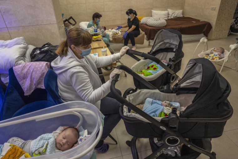 Nannies take care of newborn babies in a basement converted into a nursery in Kyiv on Saturday, March 19, 2022. Nineteen surrogated babies were born to surrogate mothers, with their biological parents still outside the country due to the war against Russi