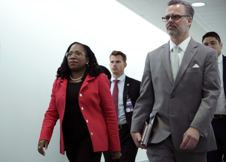 Image: Supreme Court nominee Judge Ketanji Brown Jackson walks with her husband, Patrick, before her confirmation hearings on March 22, 2022.