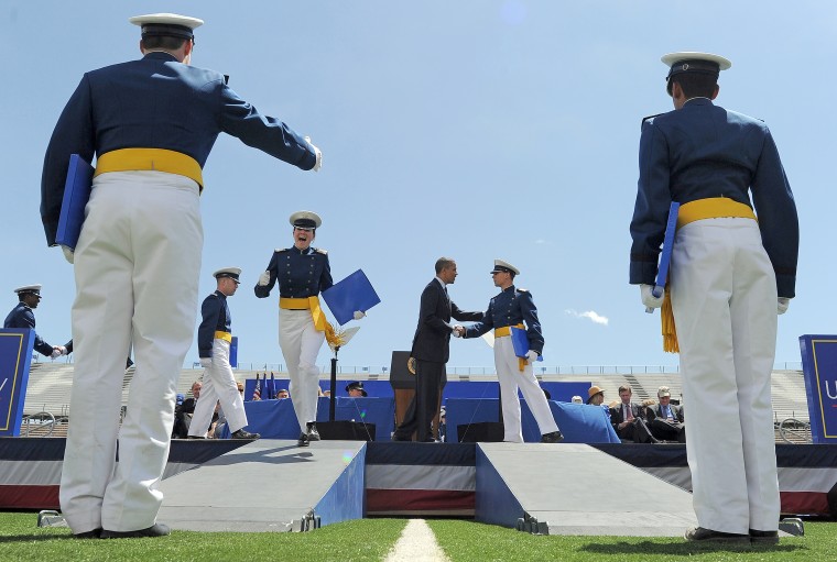 Graduates celebrate as they are greeted by President Barack Obama at the U.S. Air Force Academy in Colorado Springs, Colo., on May 23, 2012.